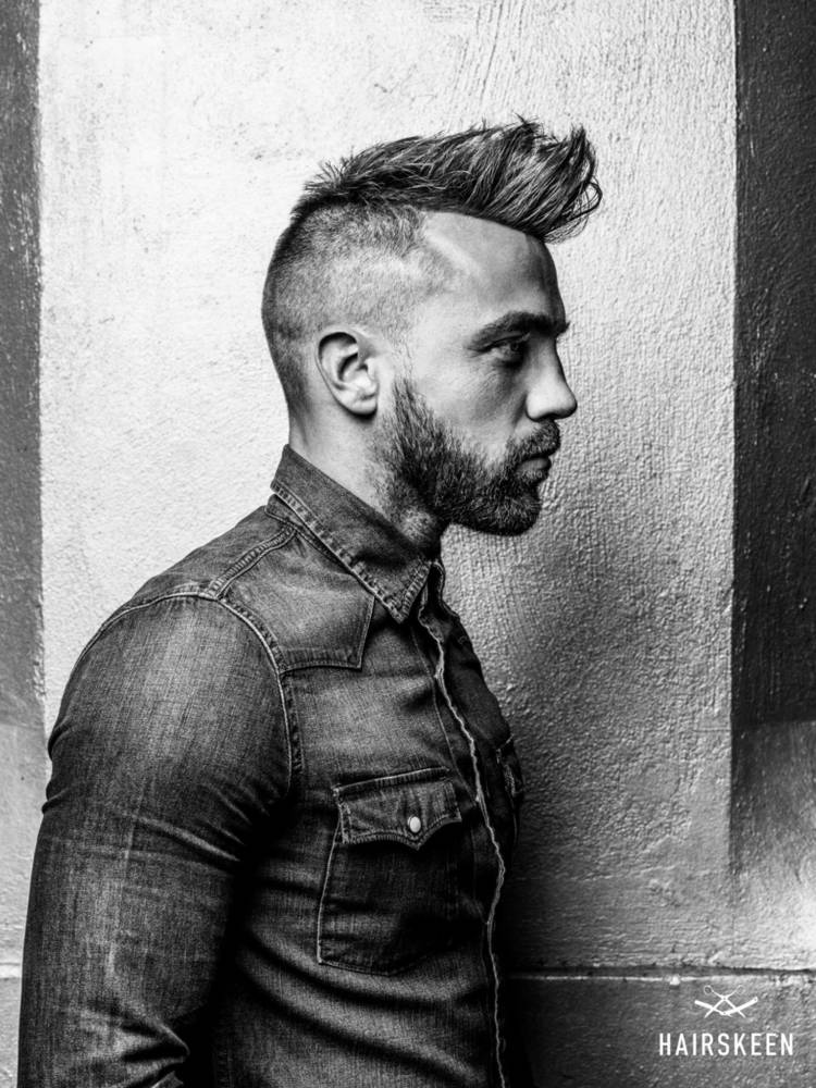 Man with a stylish mohawk and beard showcasing a natural hair replacement system