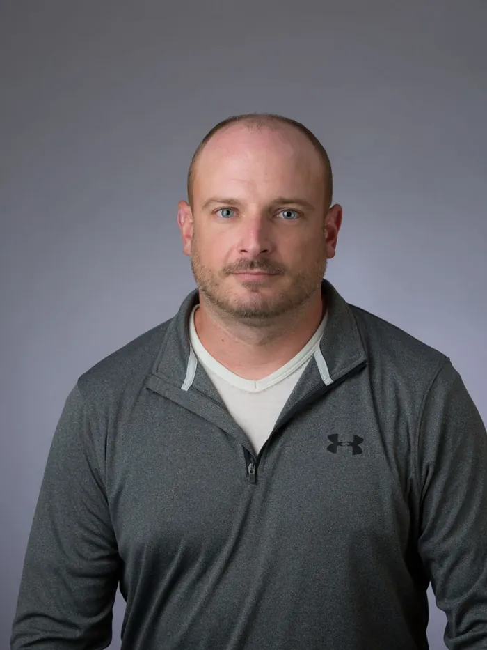 Before: a bald crown, square on to the camera against a gray studio backdrop
