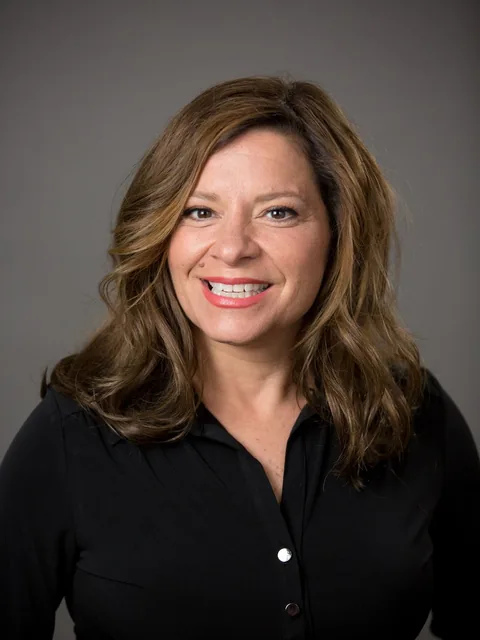 After: thick, styled, natural-looking hair after non-surgical hair replacement for women